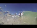 BOOGIE BOARDING WEDGES NEXT TO ROCKS