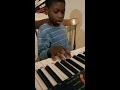 Isaiah playing piano