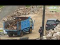 New Road Construction With Excavators And Trucks Digging Cutting The Limestone Hills