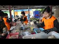 Experts cutting and packaging coconuts