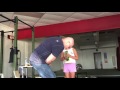 Grandmaster Strongman Dennis Rogers puts a frying pan into a water bottle.