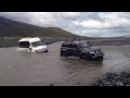Van full of tourists stuck in river in Iceland