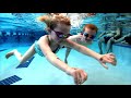 Cute Kids Jumping into the Pool at Scuba Adventure