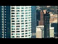 time lapse of of shadows passing over skyscraper in downtown los angeles