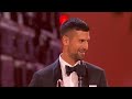 Novak Djokovic receives Laureus World Sportsman of the Year Award from Tom Brady