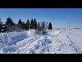 Cat 140M2 working deep snow with Falls V plow