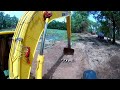 Excavator digging pond restoration using skill