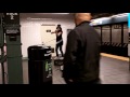 New York subway busker performs both violin and hula hoop at the same time