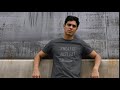 video of a man with a crewneck t shirt leaning against a concrete wall 32021