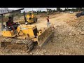 Bulldozer KOMATSU D21P'' Push Land with 5Ton Dump Truck
