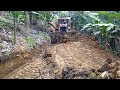Excellent BULLDOZER D6R XL working to tidy up banana plantation roads