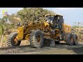 Amazing driver of heavy construction machinery with a massive SDLG motor grader for pushing gravel