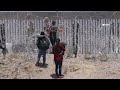 Migrant Family stopped from Hopping Border Wall on Texas - Mexico border