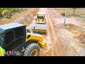 Awesome Construction of village road subgrade with motor grader Komatsu pushed the piles of land