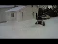 Dad plowing driveway between the house and barn.