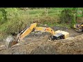 CAT 320GC Excavators Digging Dam Foundation Hole