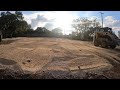 Using a skid steer to build up the foundation for a shop pad