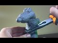 Sculpting Ratatouille “remy and his spoon” in clay.