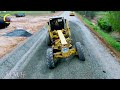 The construction process begins with clearing & grading the Gravel with a Grader to create the base