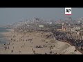 Palestinians in central Gaza wait for aid trucks to roll off pier built by US