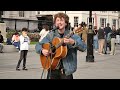 Andrew Duncan, guitar busker in Trafalgar Square, London - 11th April 2024.