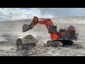 Big diger Hitachi Excavator 2500 Loading Cat 777d