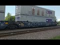 CSX intermodal freight train with a few piggy back cars