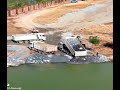 bulldozer operate with damn truck to delete the sea