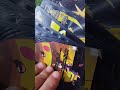 un boxing of black pokemon  cards part 1