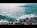 The power of the ocean in South Africa: Big waves crashing on the rocky shore under natural light.