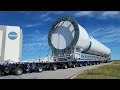 Blue Origin New Glenn Booster traveling past the VAB