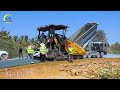 Technology is being processed by fantastic yellow gravel paver equipment to make gravel on the road