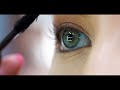 Woman applying mascara in her #eye makup#