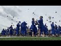 Bexley High School's Class of 2024 move their tassels and toss their caps at graduation