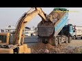 Dump Truck Unloading Rock Not Out Assisted by Excavator