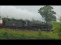 70000 Britannia hurries past a wet Beeston signal box in Cheshire 22nd May 2024