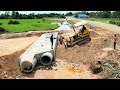 Bury the twin drainage system on the new road under construction. By dozer expert driver in process